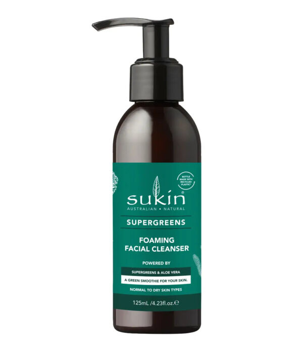A 125ml pump bottle of Sukin Supergreens Foaming Facial Cleanser. The bottle is dark amber brown with a black pump dispenser and a prominent dark green label featuring white text.